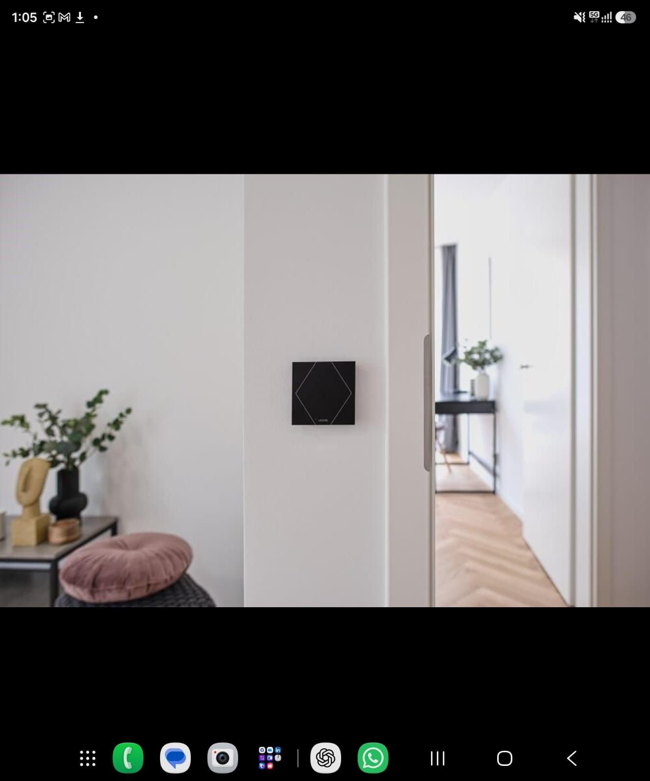 Loxone touch control panel mounted in a hallway