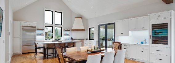 Loxone Premium plan — open kitchen and dining space with colour-changing ambient lighting