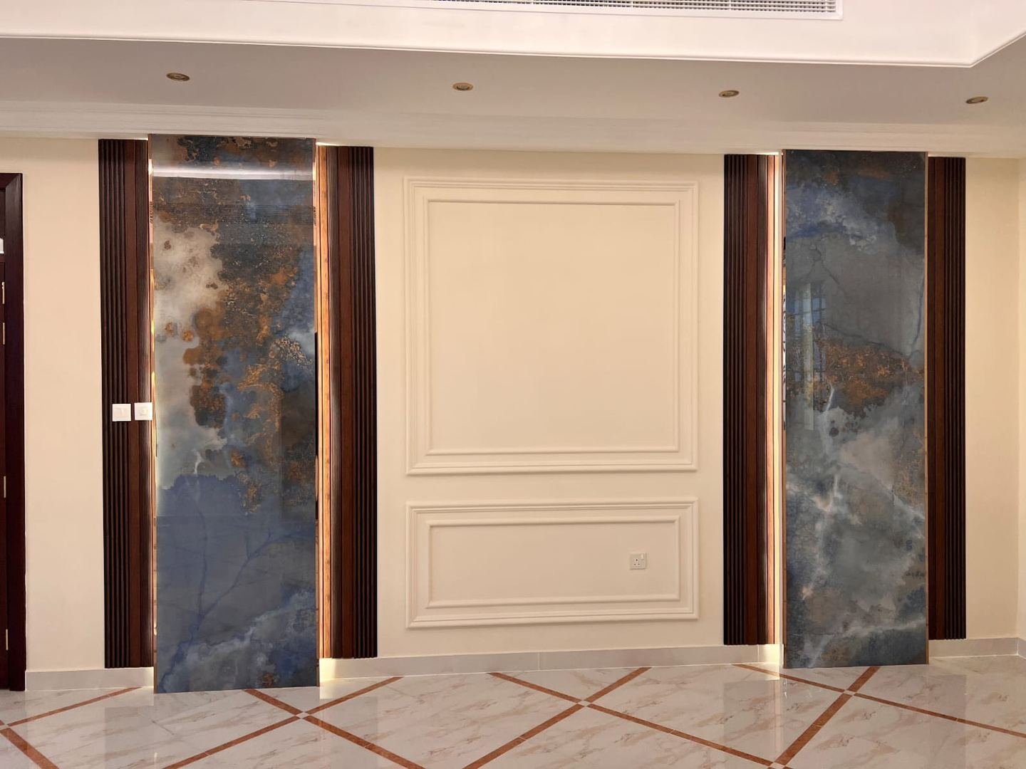 Feature wall with marble and fluted timber paneling