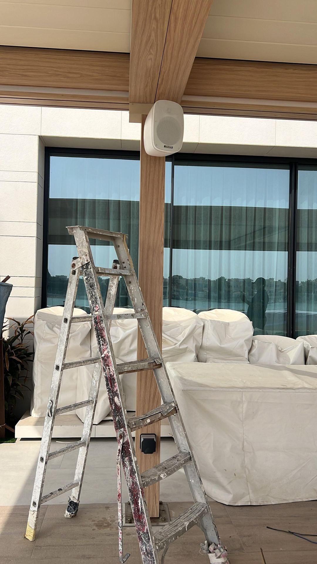 NesTech team installing an in-ceiling speaker on site