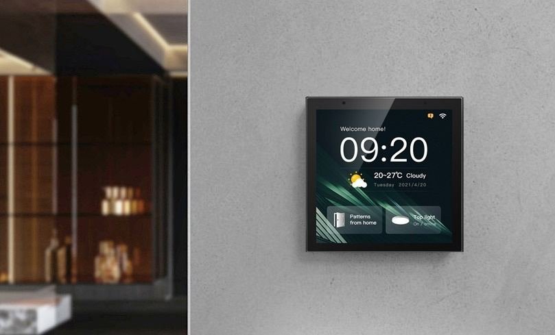 Video intercom panel mounted beside an interior entrance