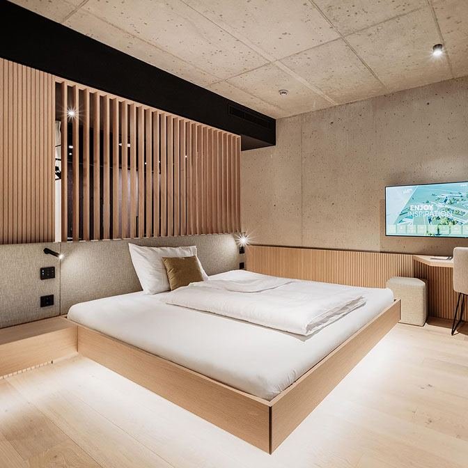 Bedroom fitted with integrated ambient lighting